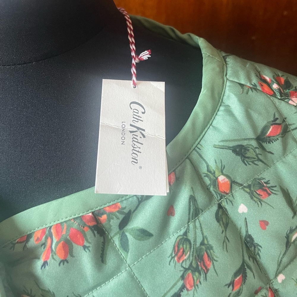 Green floral jacket/coat. Size UK 12 but runs rather large, would fit US 16/18.